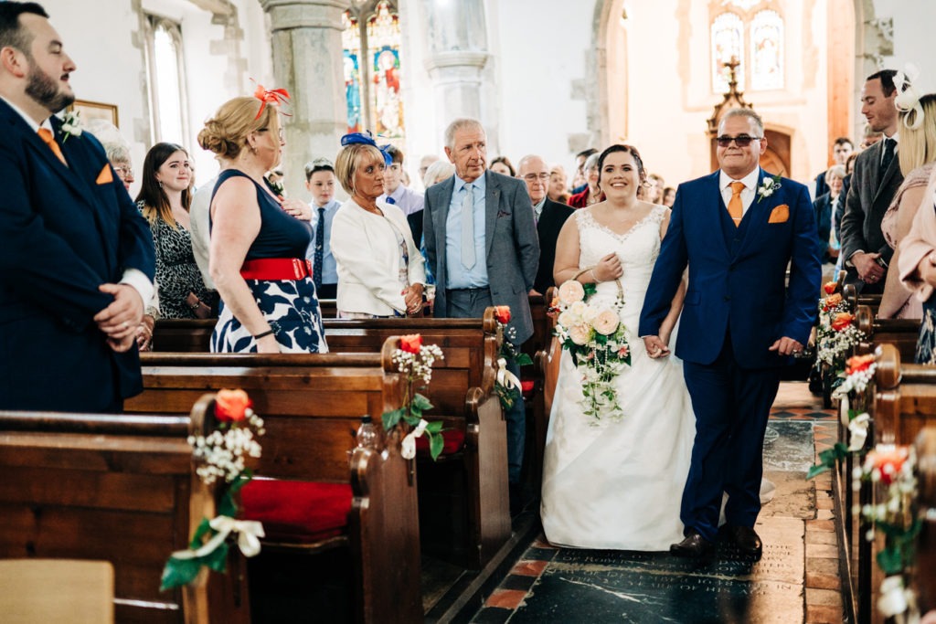 bride and dad entering church for wedding
