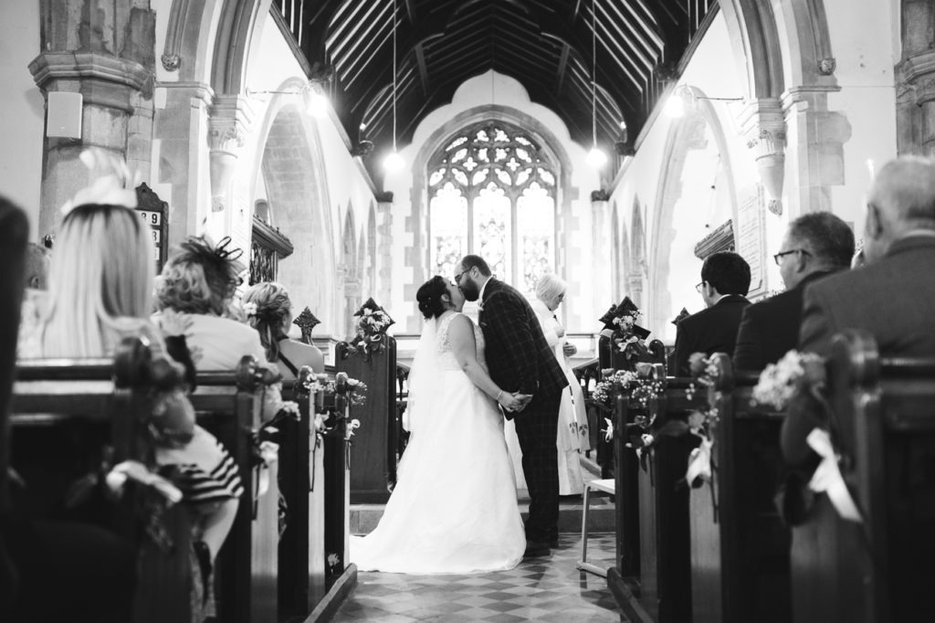 First kiss at hartlip church wedding ceremony