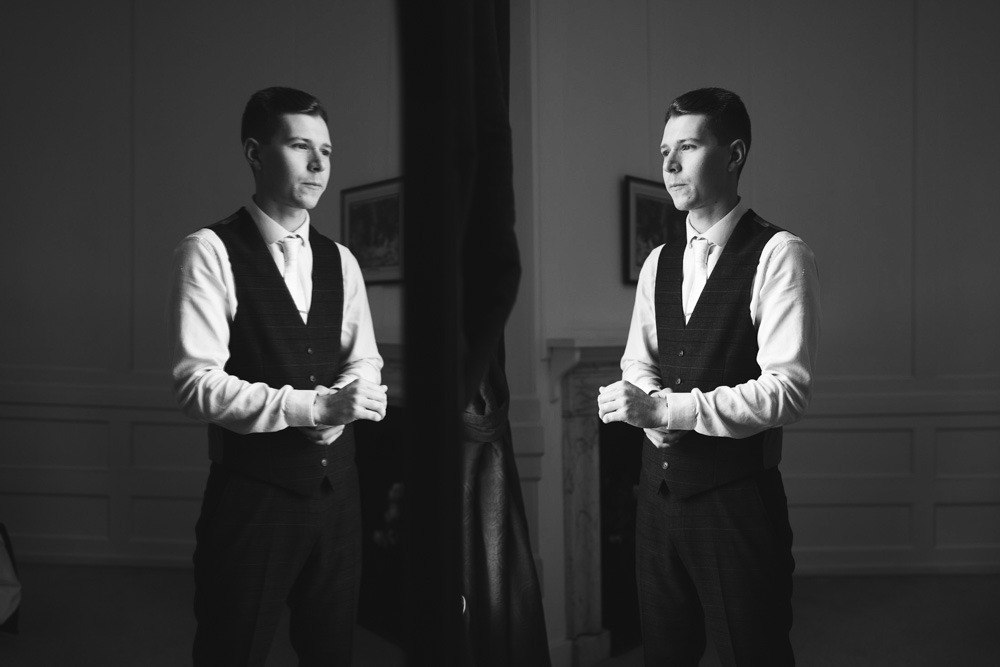 groom getting ready at Gosfield Hall