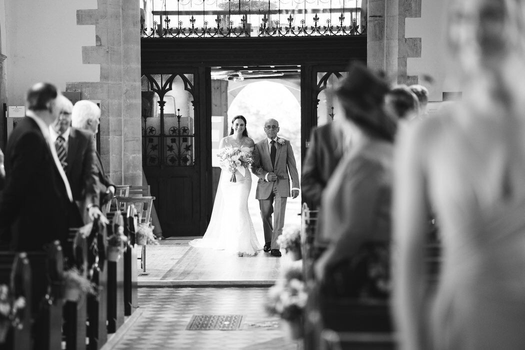 Bride and father enter the church