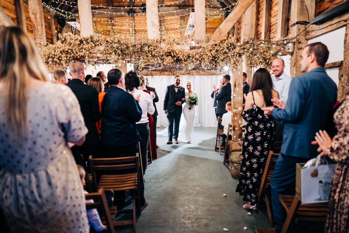 wedding ceremony in the Apple Barn at The Barnyard